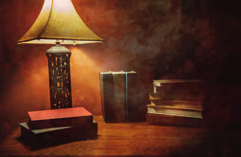 Moody workspace with books and notebook