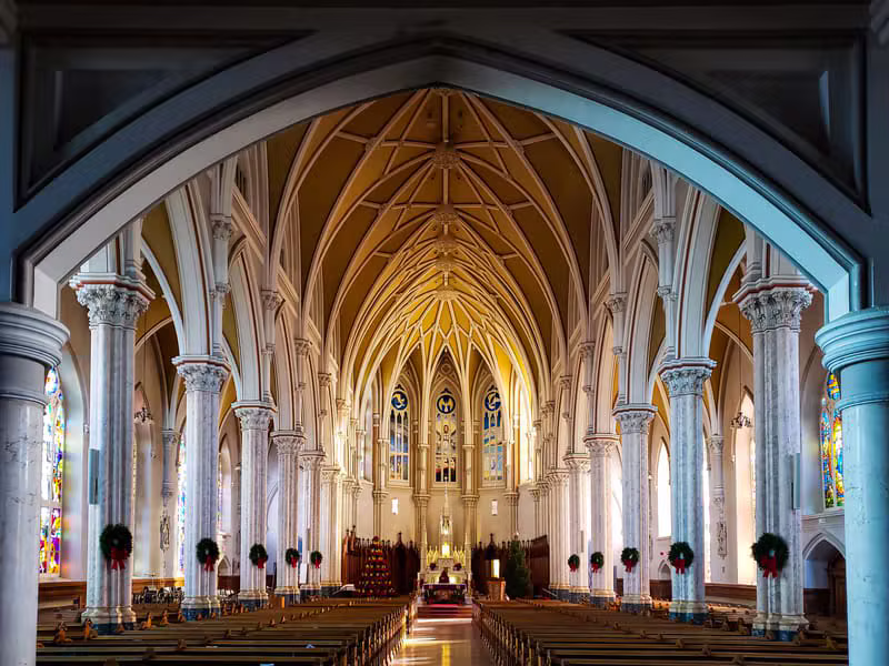 Warm light streaming through stained glass