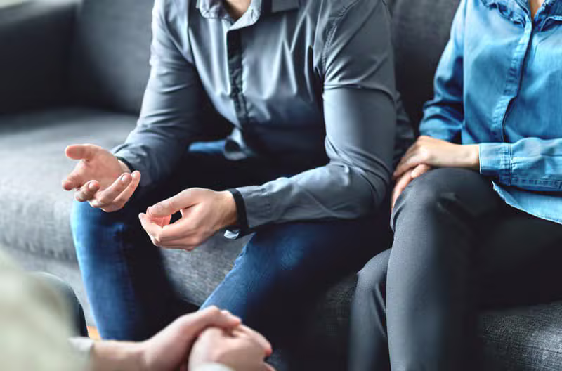 Professional mediator speaking with clients