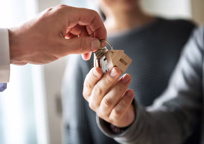Happy property owner receiving keys