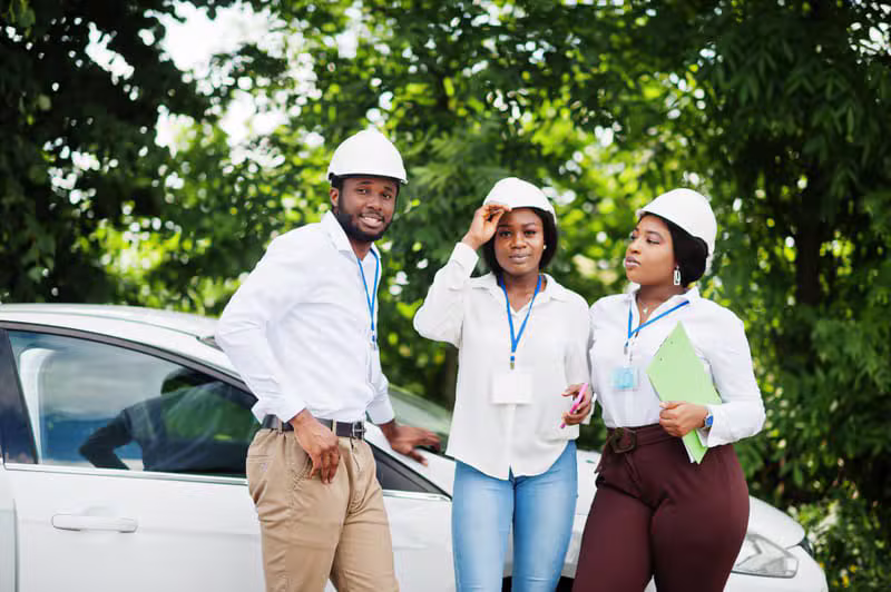 Black African surveyors inspecting verified landed property
