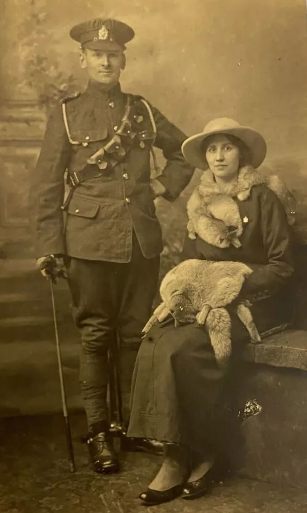KEH Trooper in Service Dress with his wife who is wearing the distinctively shaped KEH sweetheart lapel badge.