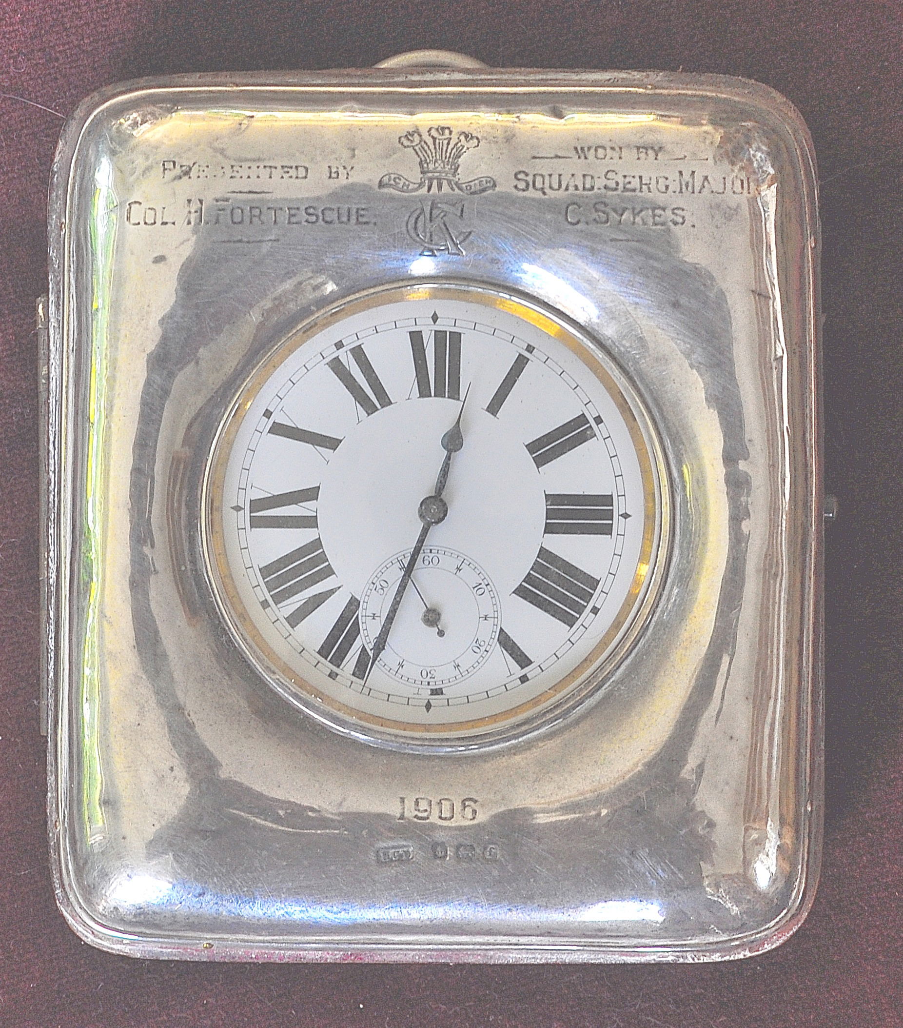 SYKES, Collingwood. SQMS King's Colonials and KEH. Engraved traveling clock bearing the emblem of the Kings Colonials. The silver case bears the inscription “Presented by Colonel H Fortescue. Won by Squad Serg Major C Sykes. Dated 1906.” This traveling clock was won as first prize for Permanent Staff at the Regimental Sports Day held at Stowe on Saturday 18th August 1906 while the King’s Colonials were at their annual fortnight camp. Courtesy of Adrian Weston, his great grandson.