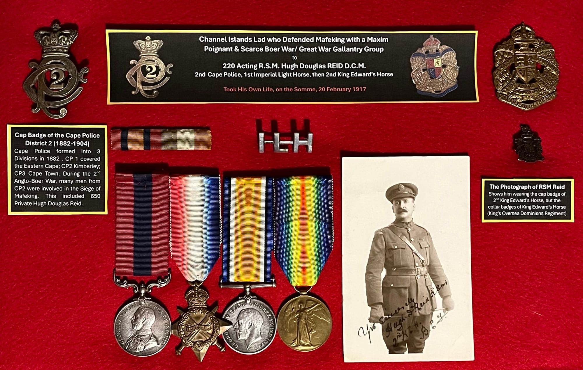 REID, Hugh Douglas. 220. Acting Regimental Serjeant Major. Framed selection of his cap badges and his Distinguished Conduct Medal and 1914/15 Star trio (courtesy of a private collector).