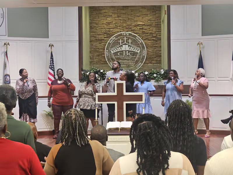 Praise and worship team singing on stage