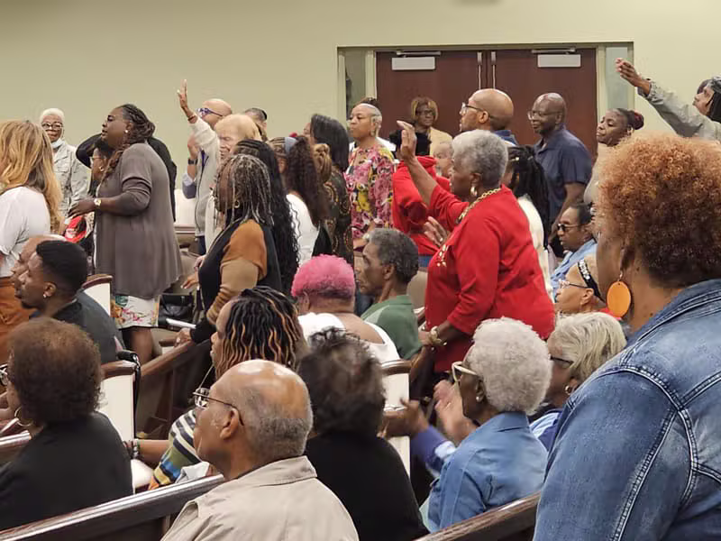 Congregation raising hands in worship