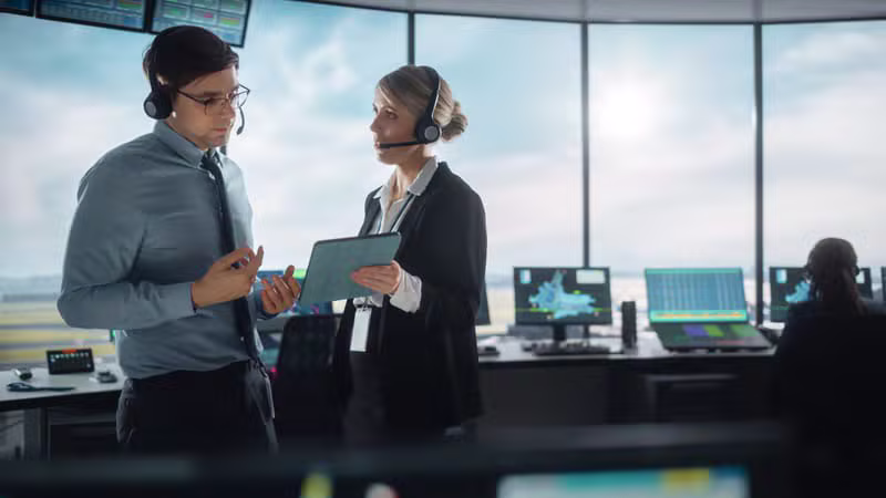 Pilot and dispatcher discussing a flight plan