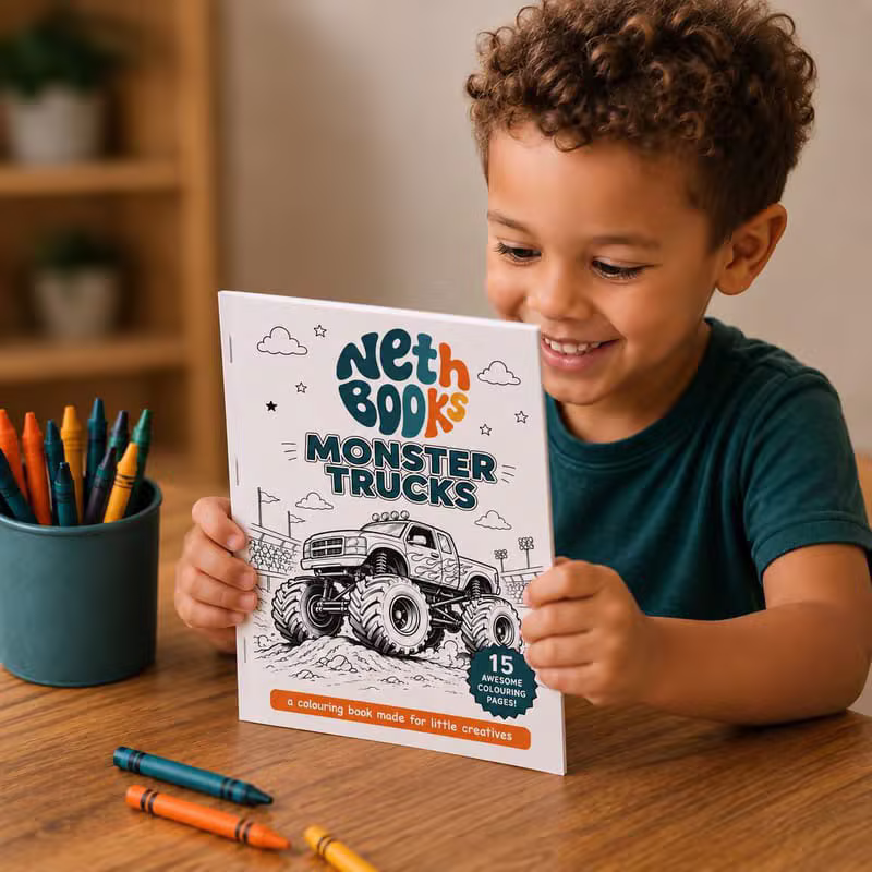Child smiling and reading a Monster Trucks custom colouring book