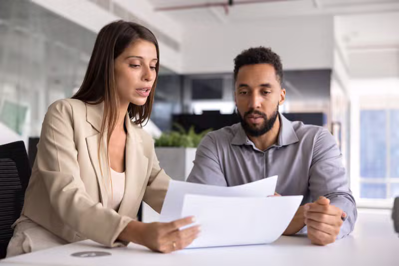 Paralegal reviewing documents in office