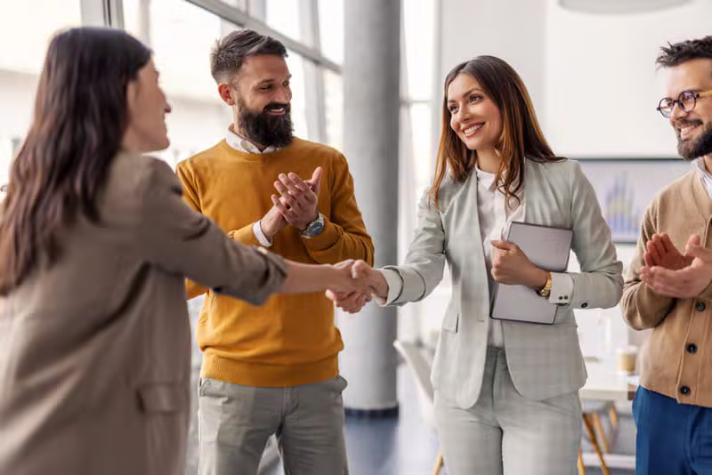 Business professionals shaking hands