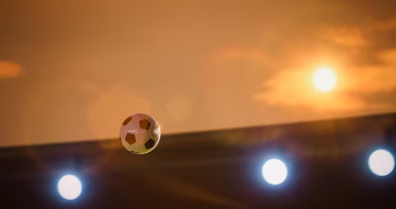 Live football match in a grand stadium