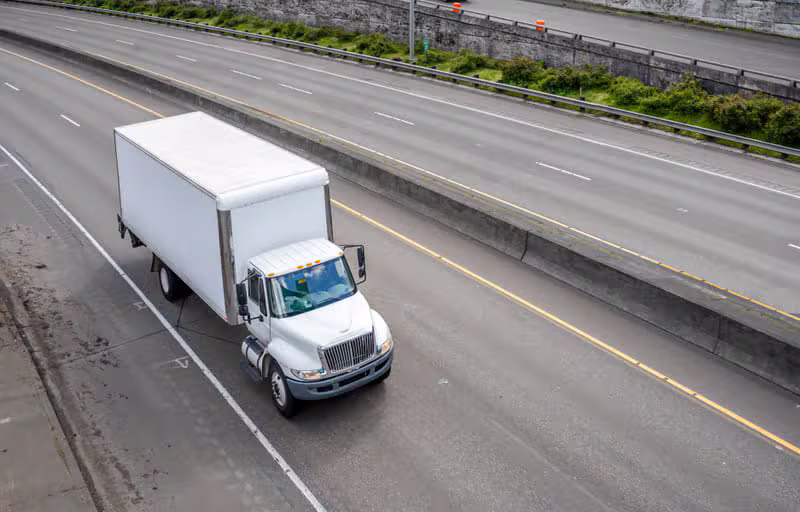 Box truck driving on the highway