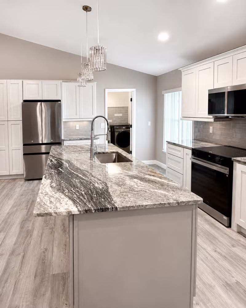 Beautifully remodeled kitchen with marble island