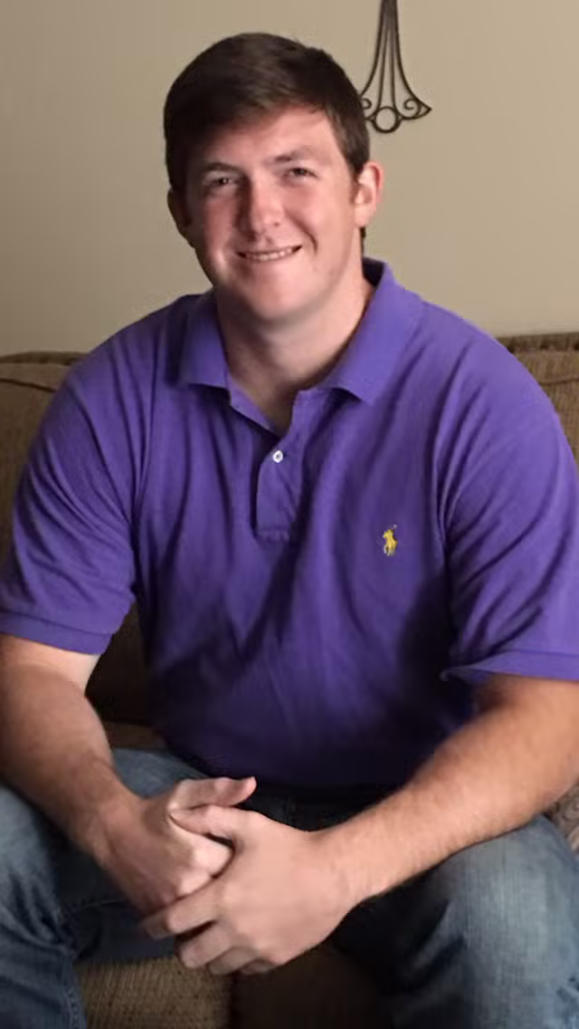 Andrew Joseph Maxey in a purple shirt