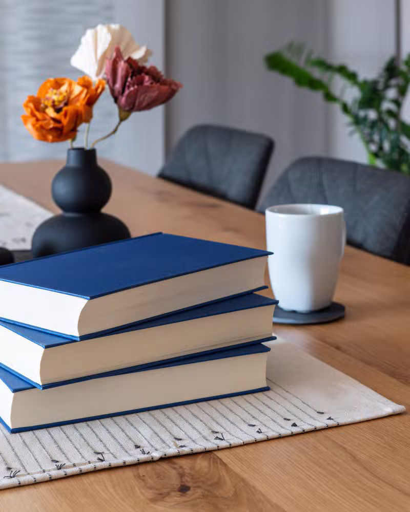 Cozy stack of books indicating a reading session