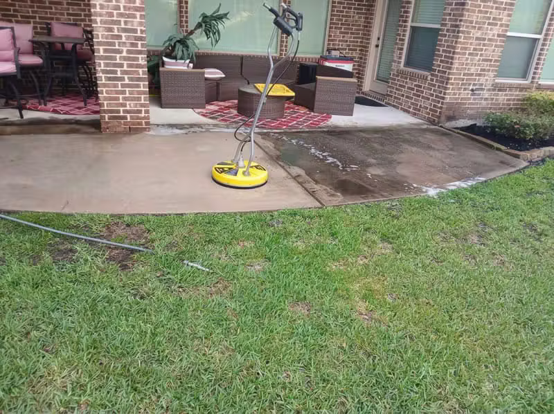 Concrete patio surface cleaning in progress