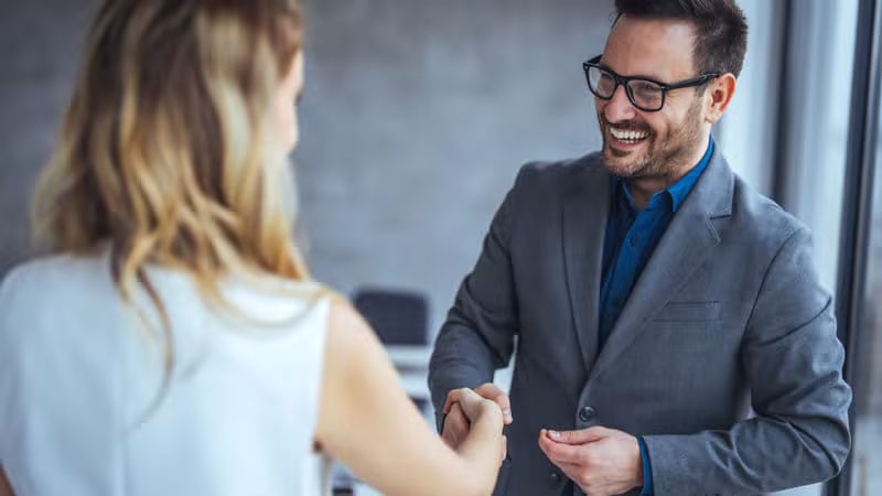Real estate professionals shaking hands