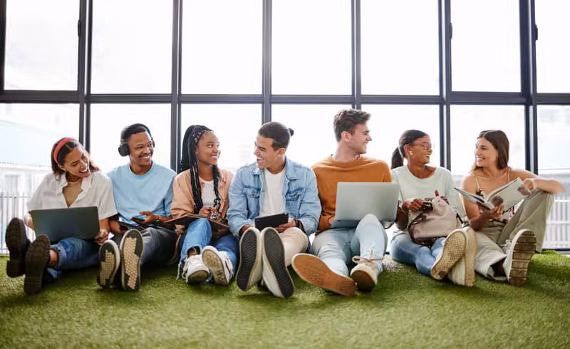 Young African entrepreneurs collaborating around a laptop