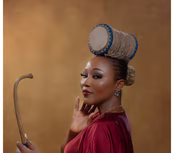 Abike Ilu with her signature talking drum hairstyle