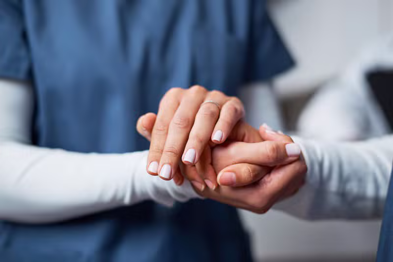 Physiotherapist helping a patient