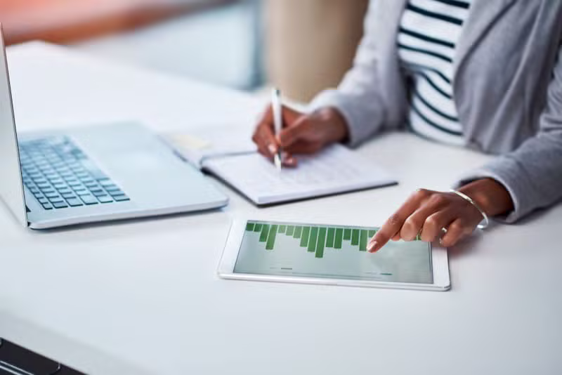 Professional reviewing modern financial dashboard
