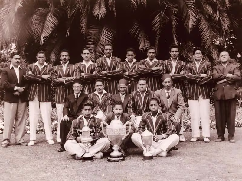 Cricket team celebrating a victory on the field