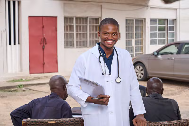 Nigerian community gathering and smiling volunteers