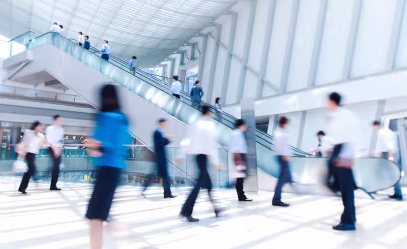 Business professionals reviewing plans in a Hong Kong office