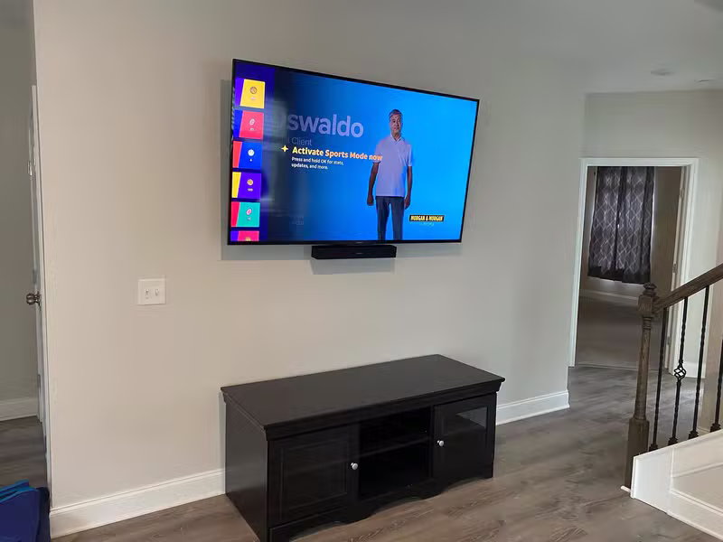 Clean beautifully mounted TV in a living room with no visible wires