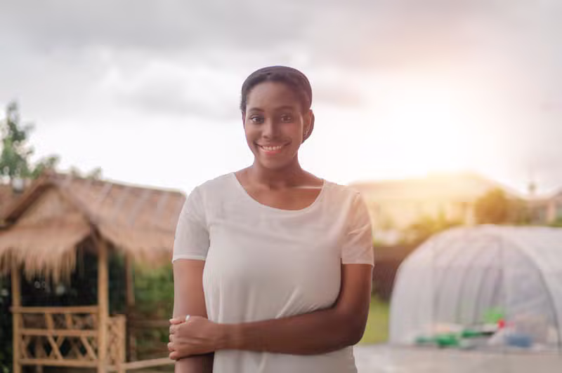 Black African guest relaxing at an eco lodge surrounded by greenery
