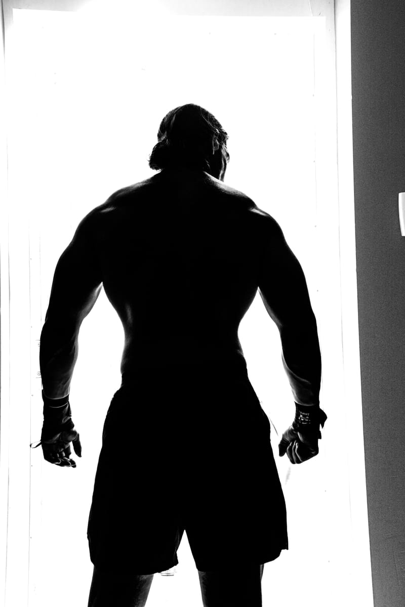 Heavy iron kettlebells on dark gym floor