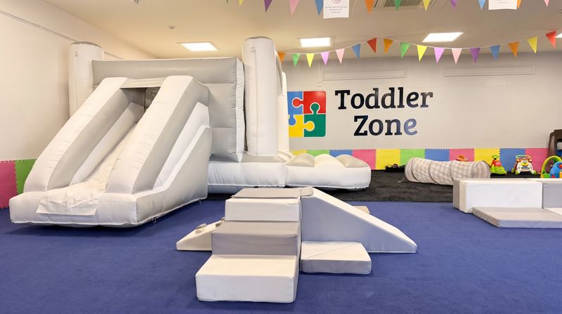 The Toddler Zone play area with bunting, soft play and a Toddler Zone chalkboard