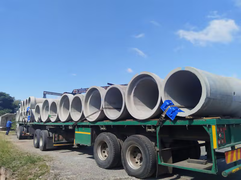 Concrete pipes on flatbed truck