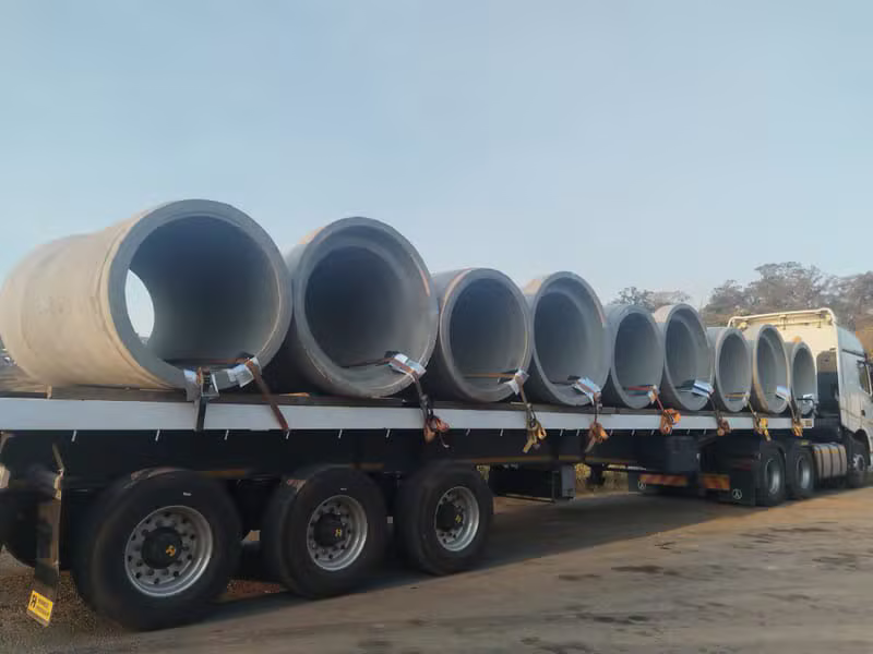 Concrete pipes loaded on a flatbed truck