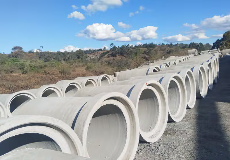 Rows of large concrete pipes outdoors