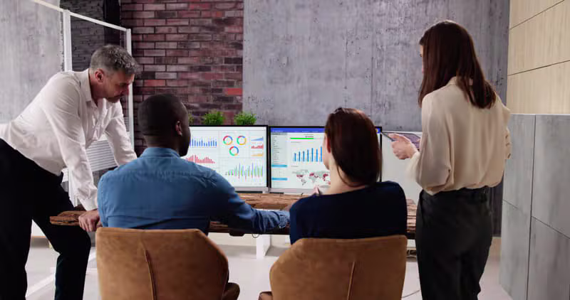 Viral Crown media buyers reviewing live paid campaign performance