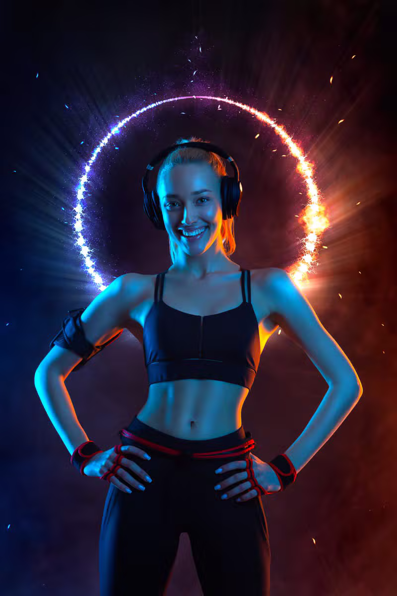 High-energy fitness class with neon lighting and DJ
