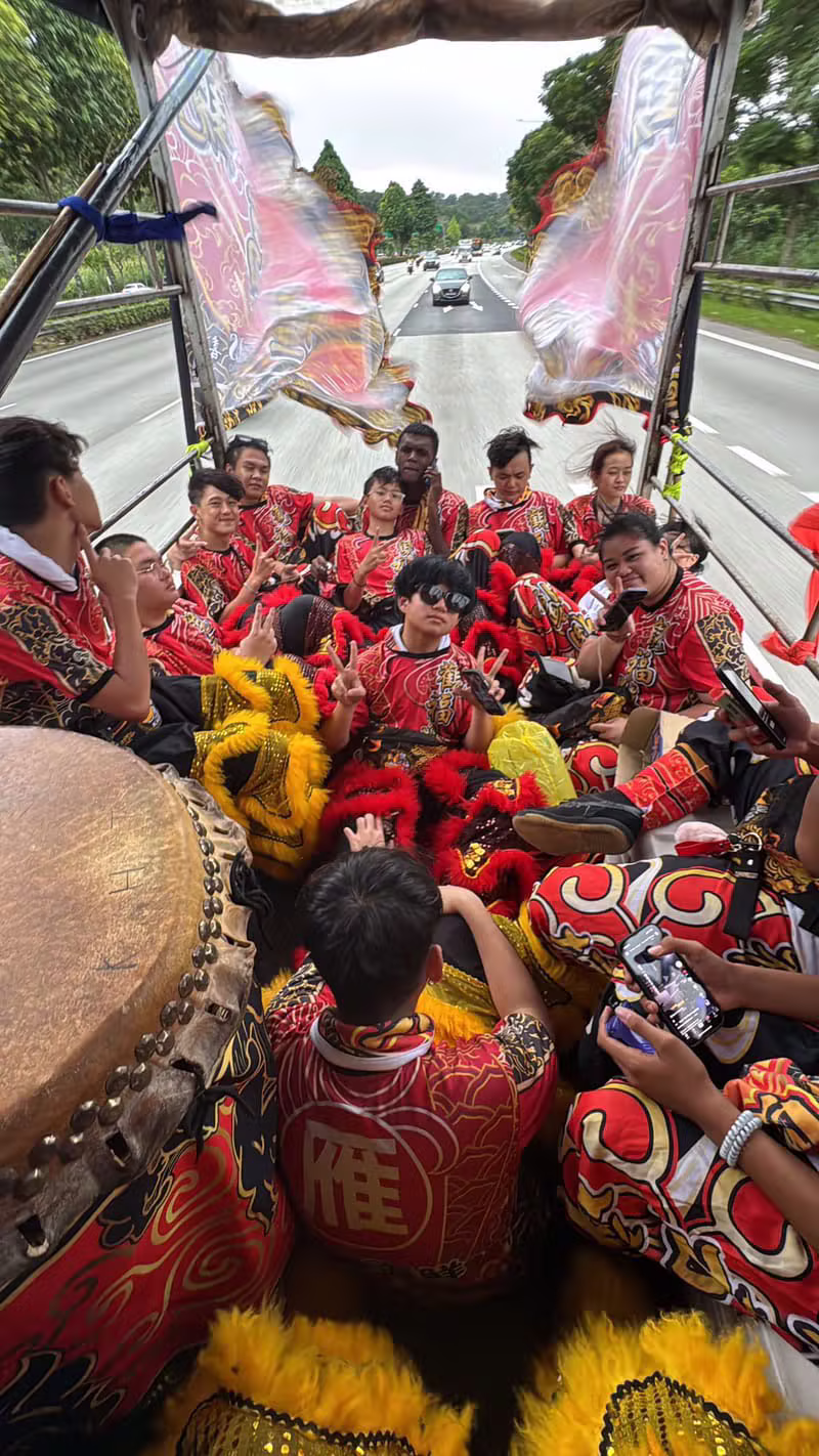 Hong Quan troupe travelling together on the lorry on the way to a performance