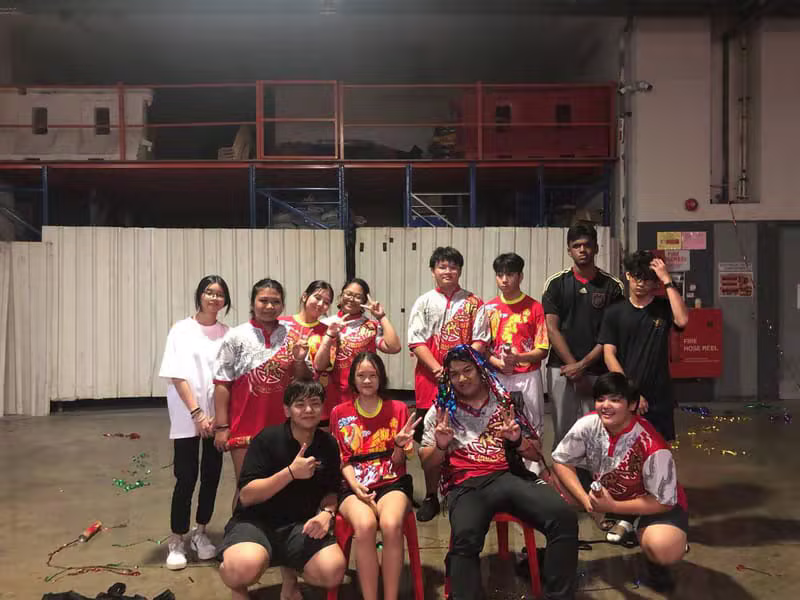 The Hong Quan troupe posing together in the training hall after practice