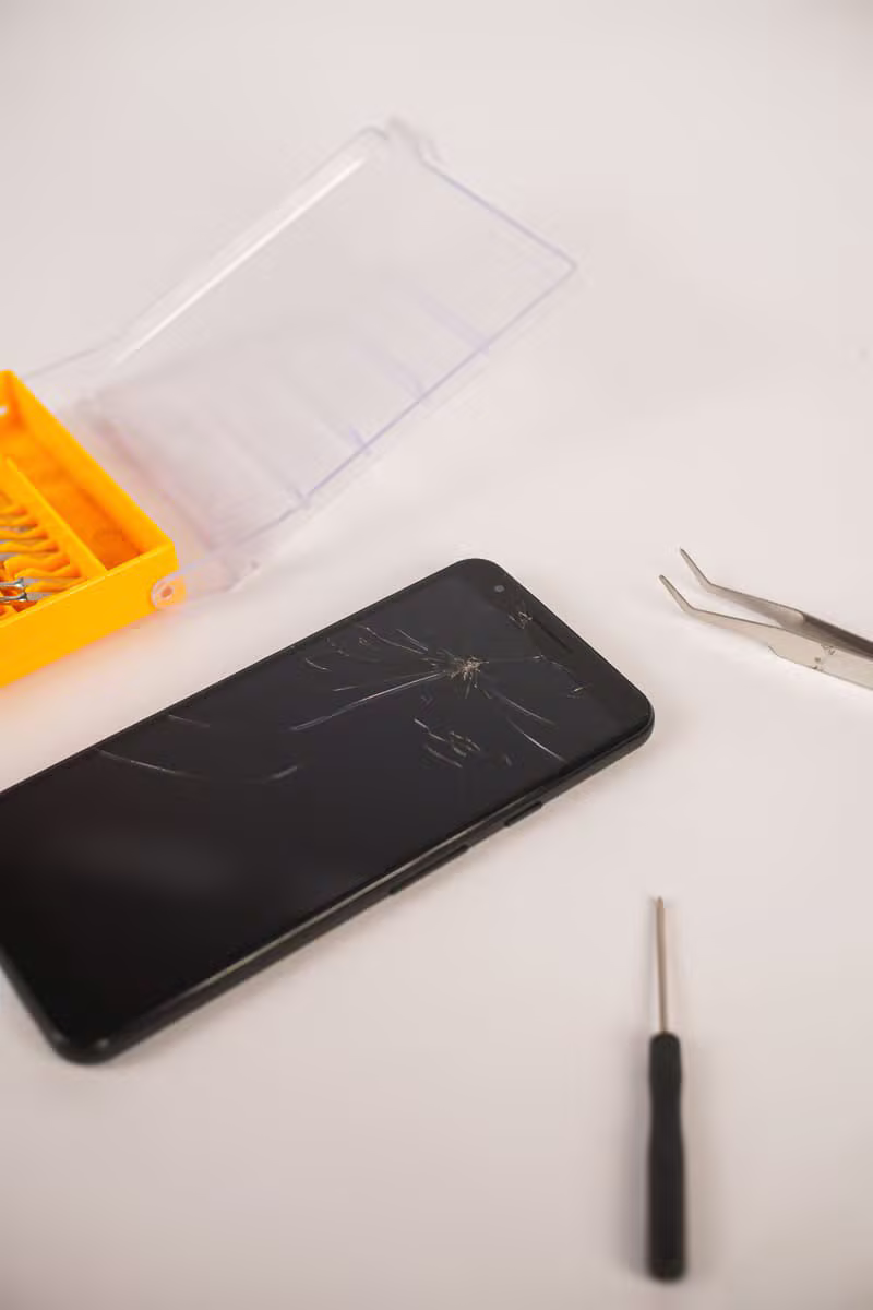 Smartphone repair toolkit arranged on a workbench