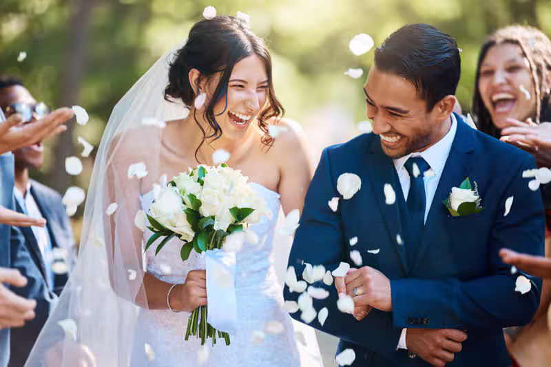 A couple celebrating during their wedding photographed by Judestudios