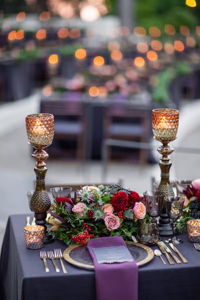 Elegant wedding reception table styled with greenery centrepieces