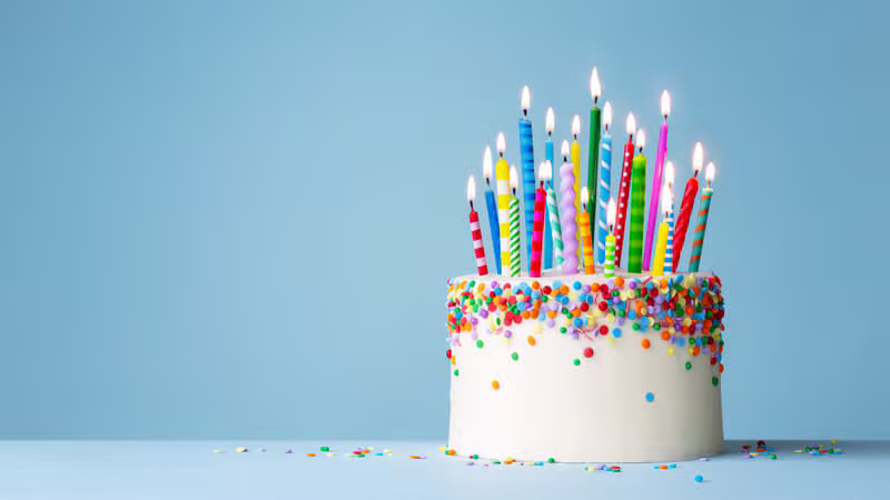 Colourful birthday cake decorated with candles