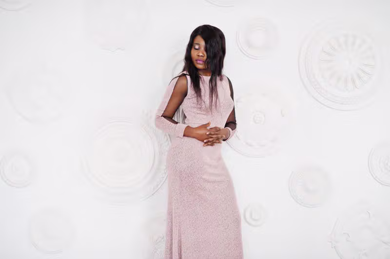 Elegant woman wearing a couture gown designed by CAF Collections