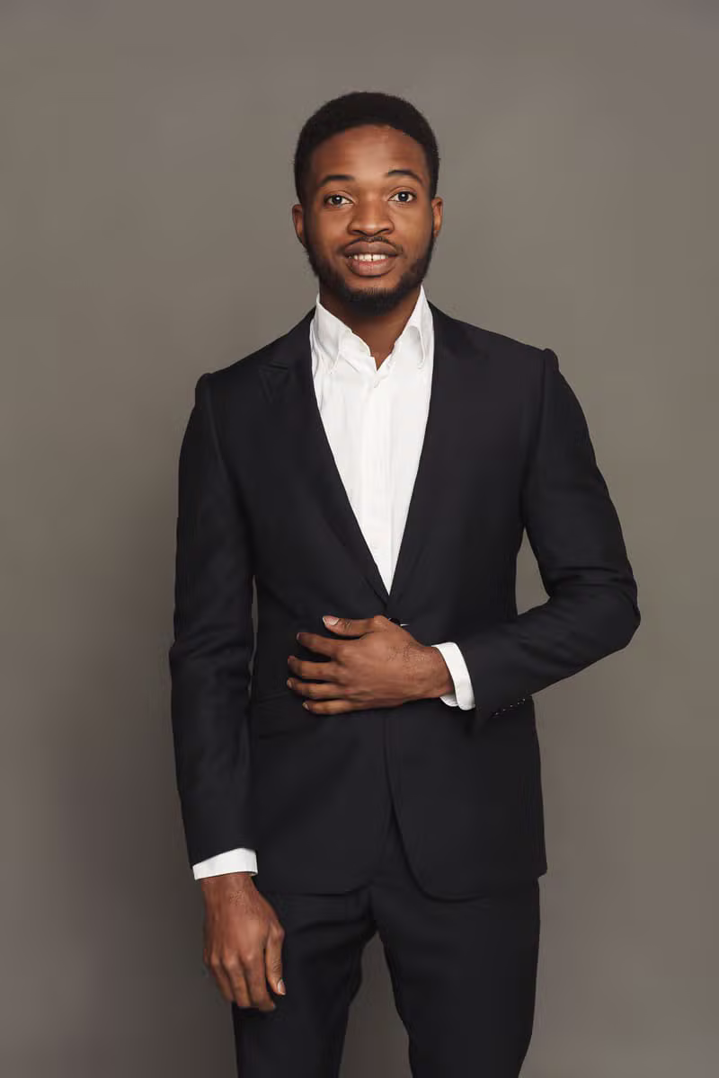 Nigerian male model wearing a formal tailored suit