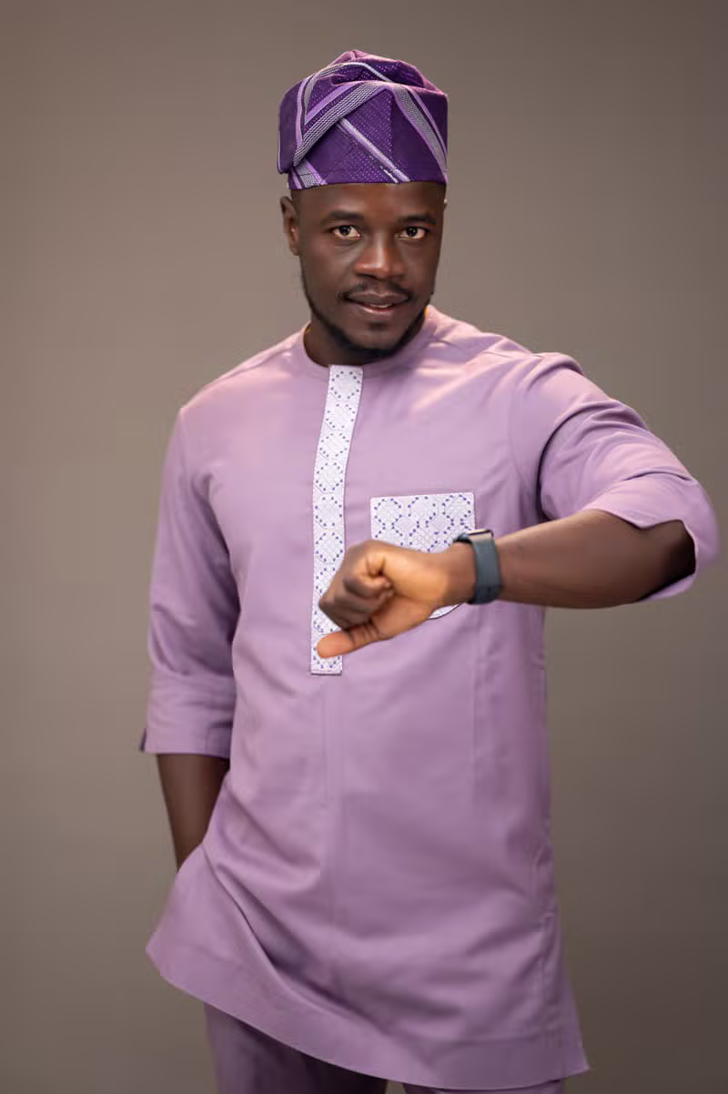 Nigerian male model showcasing fabric texture and menswear detailing