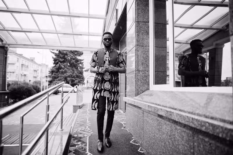 Nigerian male model wearing contemporary Nigerian menswear in a refined environment