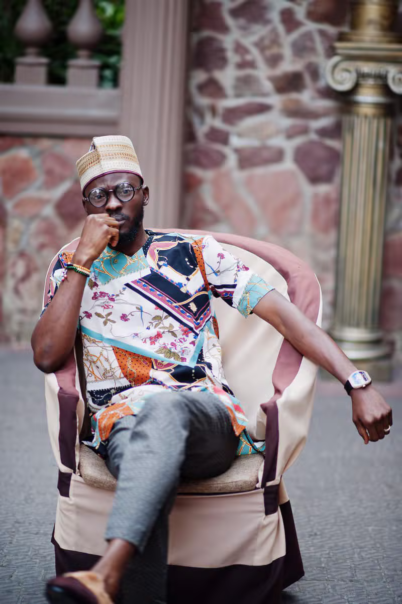 Nigerian male model wearing contemporary menswear with traditional influence