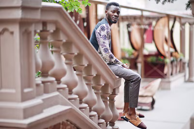 Nigerian male model wearing sophisticated contemporary menswear