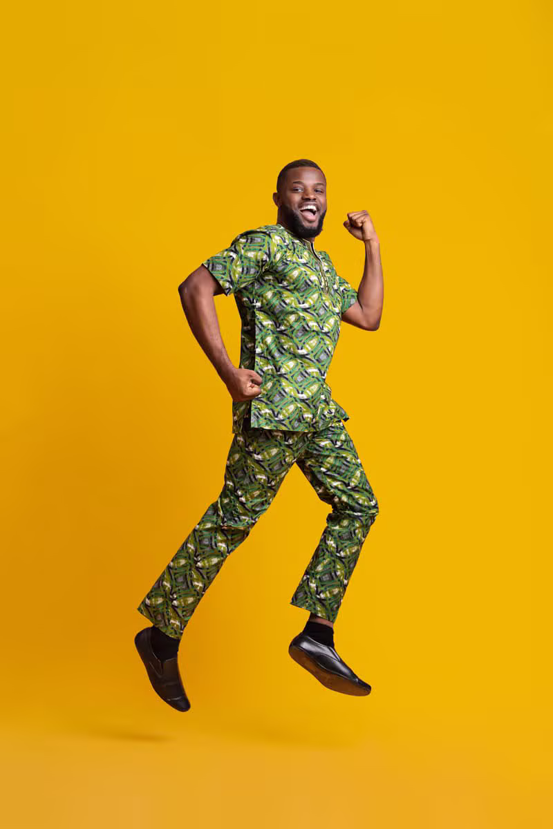 Nigerian male model wearing a short-sleeve safari suit